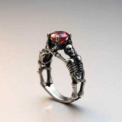 Bague du Pacte Scellé argentée avec gemme rouge intense.