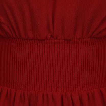Détail de la taille smockée du chemisier rouge épaules nues des vents marins.
