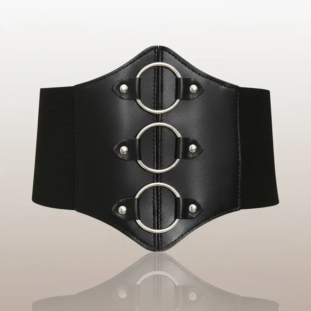Corset noir aux trois anneaux vue de face, design structuré et anneaux métalliques.