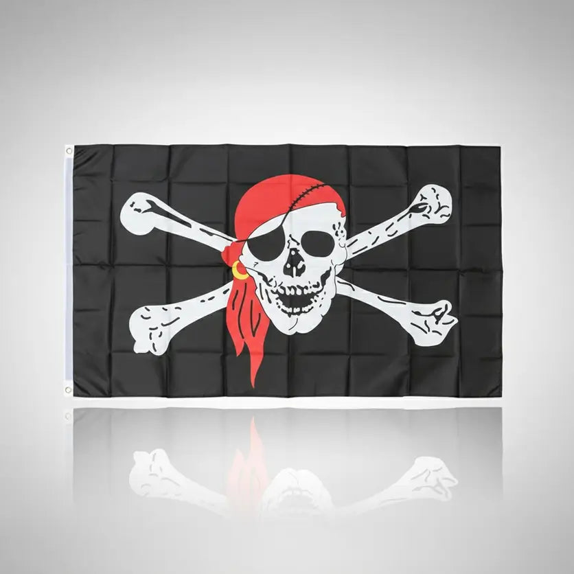 Drapeau pirate noir avec crâne, bandeau rouge et os croisés.
