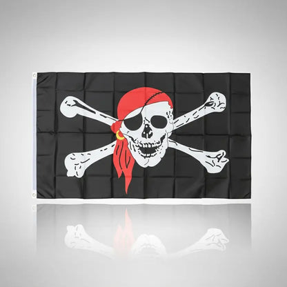 Drapeau pirate noir avec crâne, bandeau rouge et os croisés.