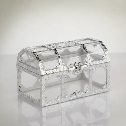Mini-coffre transparent argenté sur fond clair, design raffiné avec reflets métalliques.
