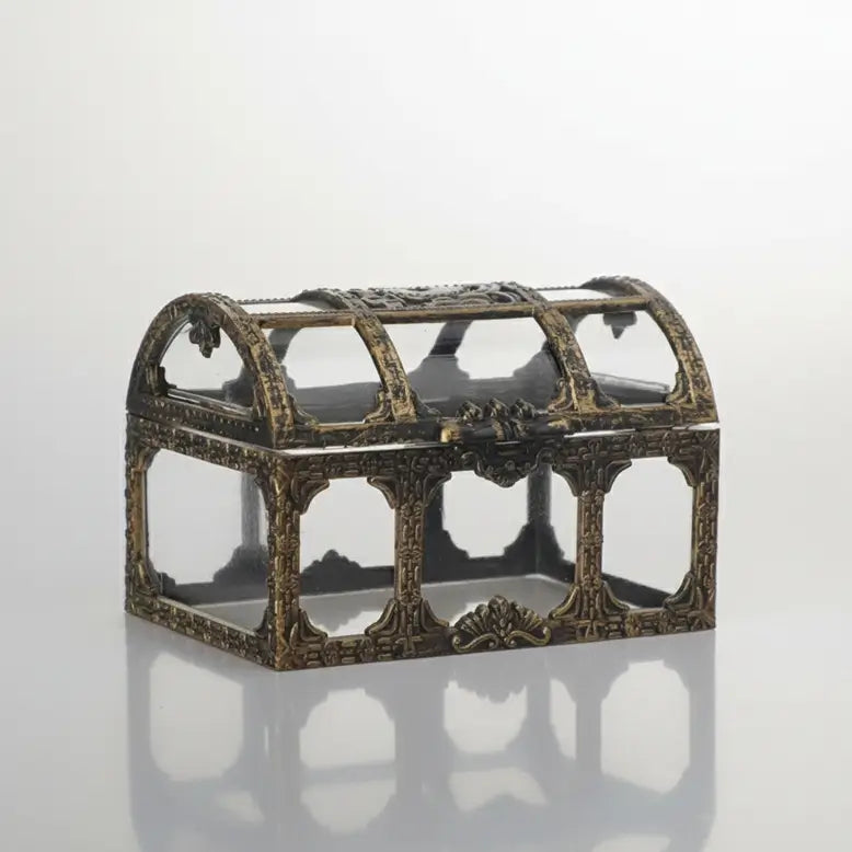 Mini-coffre transparent finition bronze, structure ajourée sur fond neutre.